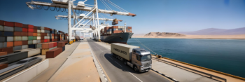A Three Lines Shipping transport truck receives cargo from an alternative deep-water port to bypass the Strait of Hormuz via a secure overland route.
