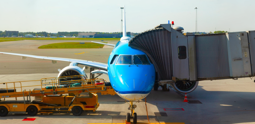A Three Lines Group bonded transport truck receiving commercial shipments directly from a cargo airplane on the Dubai airport tarmac.